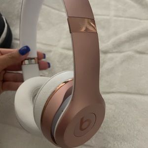 Rose gold beat headphones